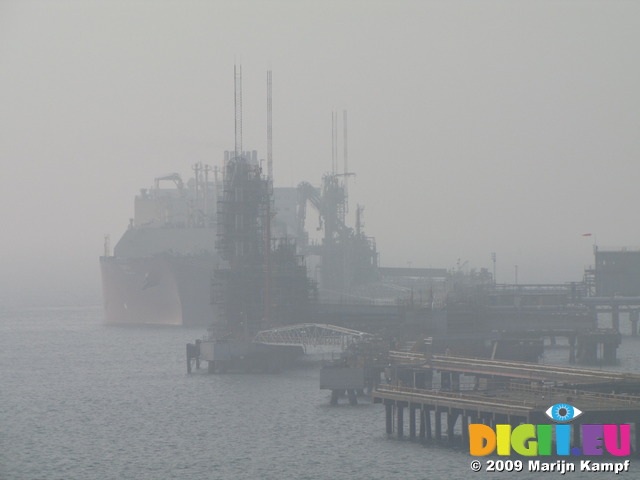 SX03449 Oil tanker moored in mist